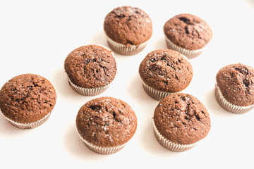 Chocolate muffins on a white plate. Confectionery.