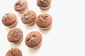 Chocolate muffins on a white plate. Confectionery.