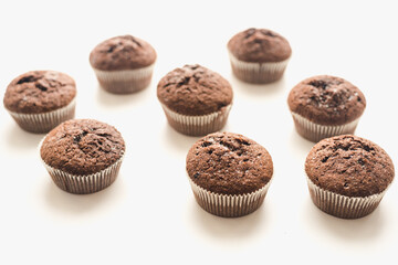 Chocolate muffins on a white plate. Confectionery.