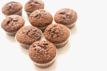 Chocolate muffins on a white plate. Confectionery.