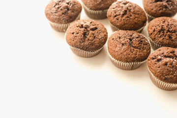 Chocolate muffins on a white plate. Confectionery.