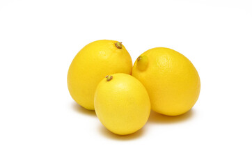 whole ripe lemons close-up isolated on white background