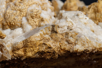Macro mineral stone Snow quartz with calcite on a black background