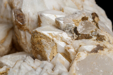 Fototapeta na wymiar Macro mineral stone Snow quartz with calcite on a black background