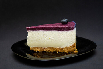 Unbaked blueberry cheesecake on an empty space with close ups 