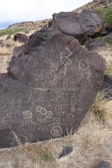 Indian petroglyphs on a gray rock in Idaho