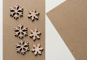 christmas snowflakes made of wood and cardboard 