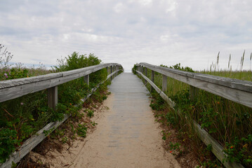 Fototapeta na wymiar Sandwich boardwalk, famous walkway to sand dunes. Cape Cod, Massachusetts, USA,
