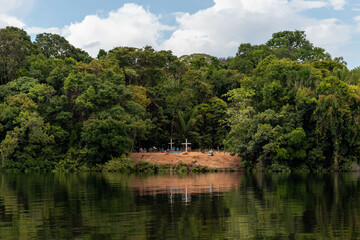 Small cemetery on the banks of a river in a traditional community in the interior of the Amazon region in Brazil