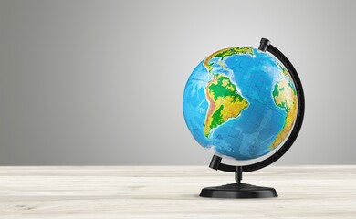 Earth classic globe on a wooden table.