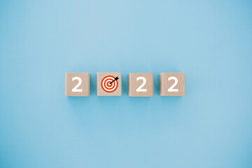 2022 with goal icon on table and blue background, copy space. Start new year 2022 with goal plan, goal concept, action plan, strategy, new year business vision