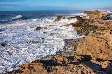 Volcanic coast of the Atlantic ocean at Essaouira, Morocco on a sunny summer day.