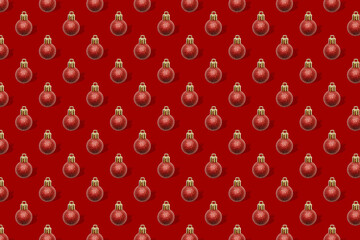 Christmas New Year holiday creative minimal seamless pattern background with red baubles balls, ornaments, Flat lay, top view