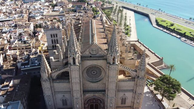 Reverse frontal panoramic view of La Seu Palma de Mallorca Gothic Roman Catholic Cathedral - 4 K video in sunny day