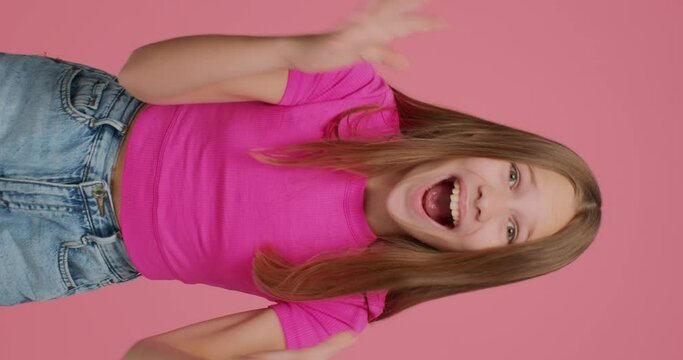 Oh my god wow. Amazed excited child girl blogger shocked by sudden news cant believe, vertical video for social network