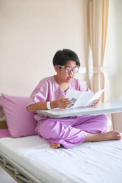 The boy patient was resting by reading health pamphlets