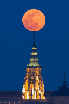 Full moon over ancient Cathedral, Toledo city twilight