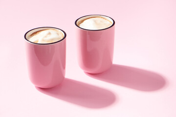 Cappuccino in Pink Cups on Pink Background