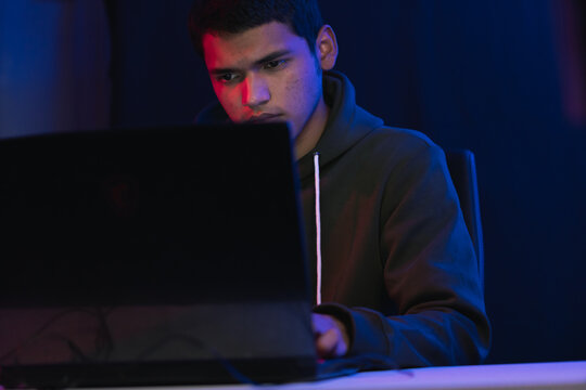 Young man doing a live video game sharing online.
