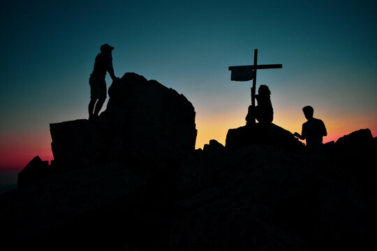 Silhouette of a group during sunset on top of corsicans mountains