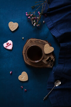 Tea cup with cookies and flowers