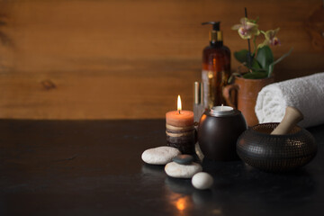 Wooden background with candles in the SPA care area