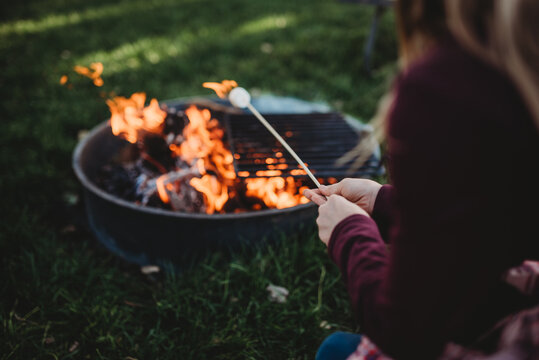 Campfire roasting smores outside activity