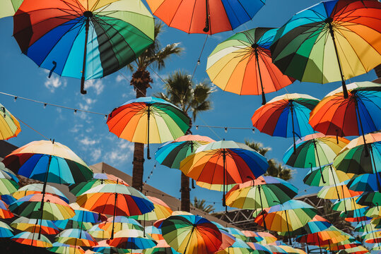 rainbow umbrellas hanging from string
