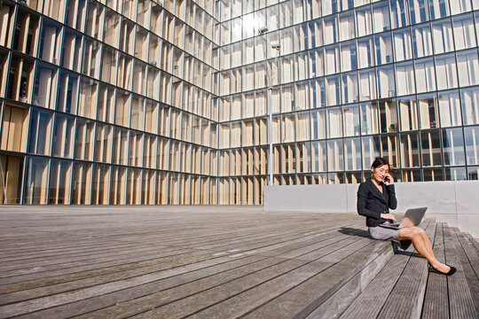 Business woman in Paris working on a laptop