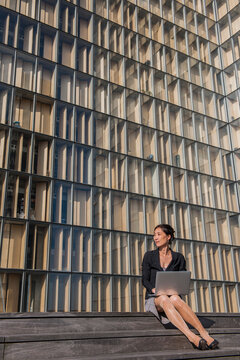 Business woman in Paris working on a laptop