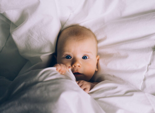 a baby in the bed