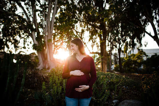 Pregnant Woman Standing in Garden During Sunset in San Diego