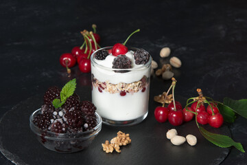 Healthy breakfast with yogurt cream, flakes, nuts and fruits