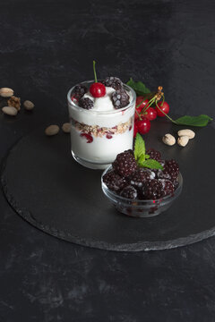 Healthy snack, yogurt cream with flakes, nuts and fruits for the