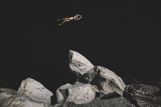 Woman Floats in a Dark Pool of Water That Looks like Space