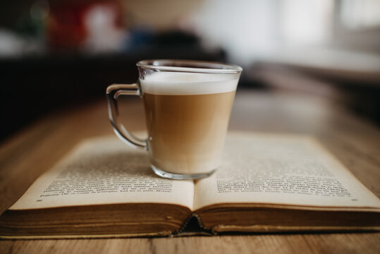 Espresson coffe on old book closeup.