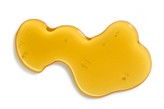 flowing honey on white background