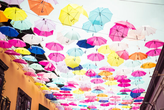 Naklejki Colourful artistic installation of umbrellas