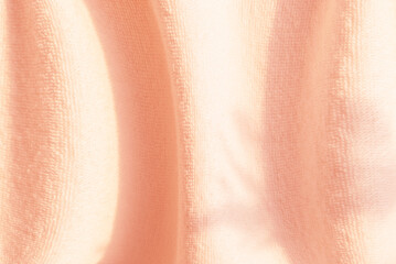 Abstract background,   pink fabric with a curved texture and natural gradation of shadows.for graphic design ,spacefor text