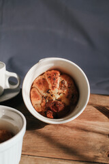 Ham Cheese Croissant with Bacon on wooden board under morning sunlight, horizontal composition. Comfort food concept