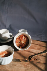 Ham Cheese Croissant with Bacon on wooden board under morning sunlight, horizontal composition. Comfort food concept