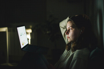woman working on laptop at night