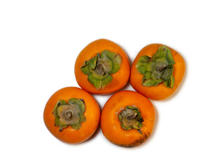 persimmon chamomile on white background. Healthy diet. Fruit on the table.