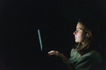 woman working on laptop at night