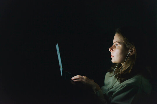 woman working on laptop at night