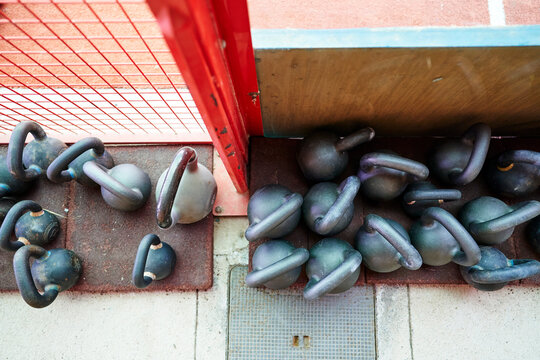Set of well used kettle bell from pov at outdoor gym