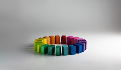 Colors in unity. Circle of colored blocks representing unity of diverse elements (colors). .Wooden...