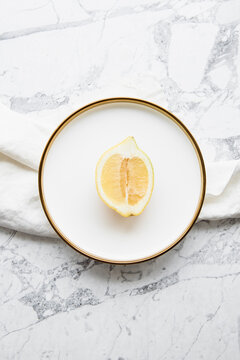 Food Flatlay of Lemon on White Marble