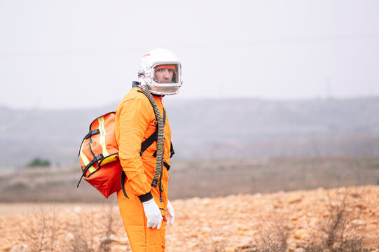 Man dressed as an astronaut with a bag isolated