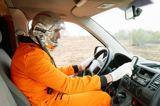 Man dressed as an astronaut using GPS